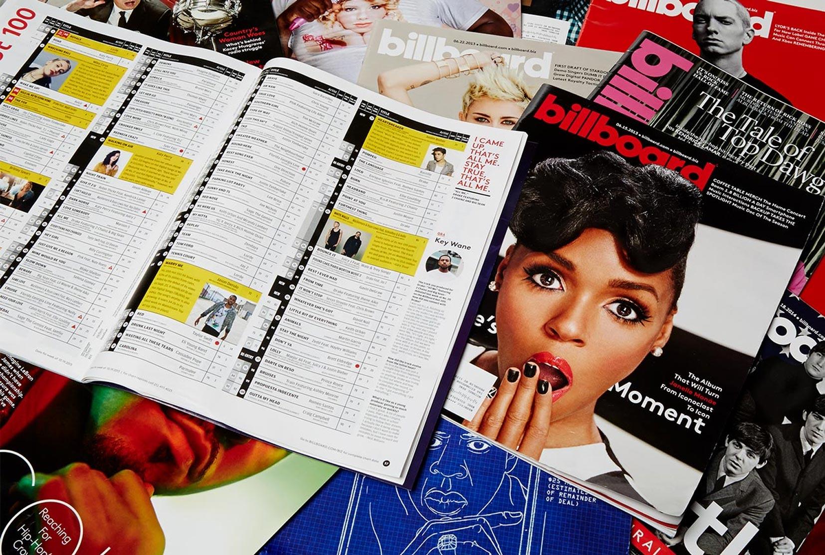A pile of Billboard magazine covers from across the chart's history
