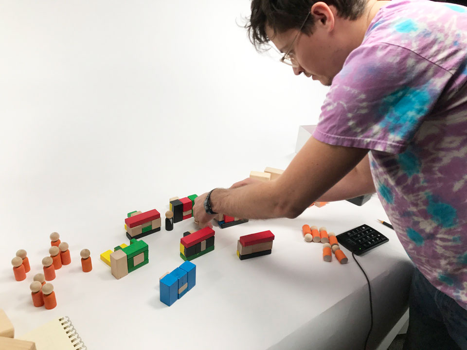 Brian McGee adjusting blocks on set